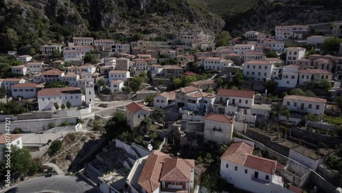 Drone video of empty descriptive plane from a bird's eye view over the village Nje Maj, Spile, Sen, on Albanian coast.
The take the flight is low at the level of the houses getting closer and closer. photo