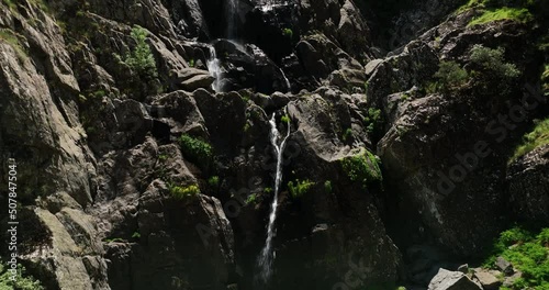 HE SPECTACULAR MEANCERA WATERFALL IN THE NORTH OF EXTREMADURA LANDSCAPED IN A NATURAL PLACE
A WATERFALL 100 
RECORDED WITH MAVIC 3 IN C4K 30FPS AND WITHOUT COLOR CORRECTION photo