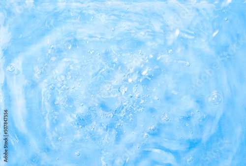 Blue water background. Summer blue wave. Abstract or natural wavy water texture background. Defocus
