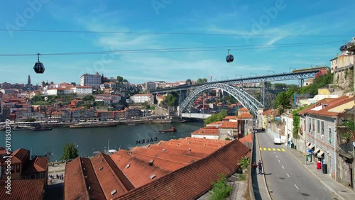 Aerial View Shot of Porto, Oporto, Dom Luis I Bridge, Douro River, Cable car Teleferico de Gaia. Old Town, Portugal. 