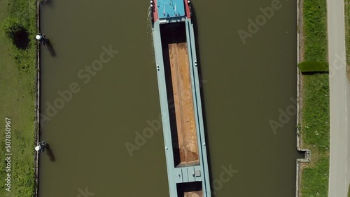 Traditional Long Motor Boat Cruising The Serene Waters Of Gouwe River In Zuidelijk Halfrond Province, South Holland, Netherlands. Aerial Top View photo