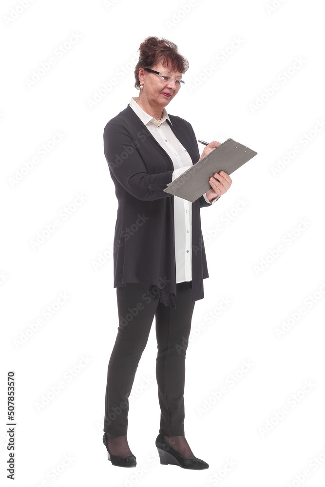 Side view of senior woman in glasses holding clipboard with paper sheet and making notes. Side view of senior woman in glasses holding clipboard with paper sheet and making notes.