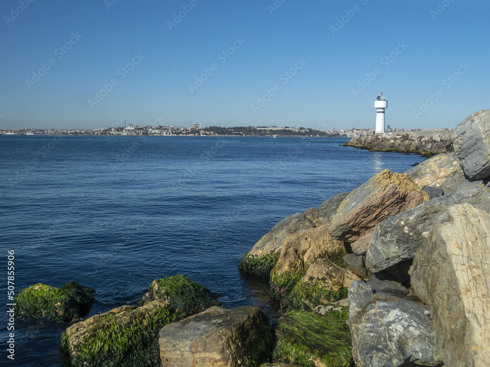 Lighthouse tower and Kadikoy harbour, view from MODA park