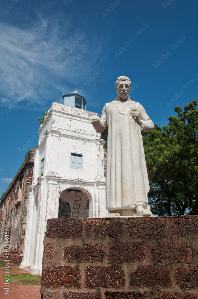 Fototapeta premium saint francis xavier statue and lighthouse melaka malaysia