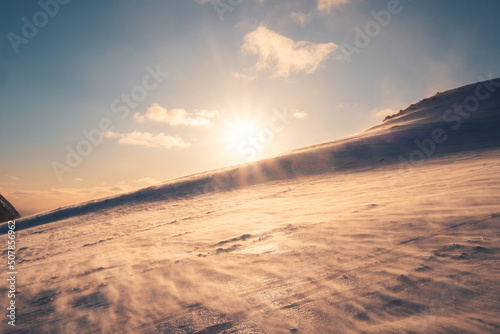 Sunset over snowy mountain and windy on Mount Ryten