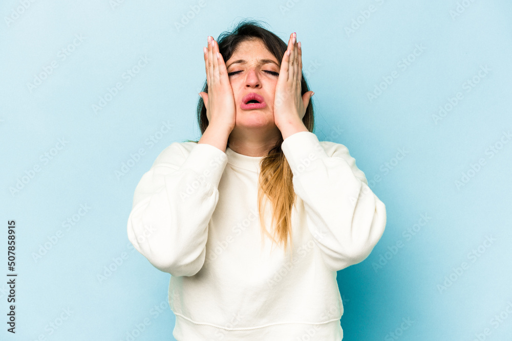 Young caucasian woman isolated on blue background whining and crying disconsolately. Young caucasian woman isolated on blue background whining and crying disconsolately.