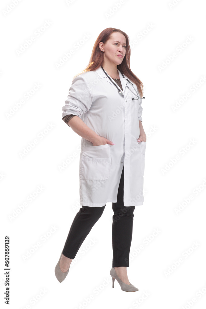 mature woman doctor striding forward. isolated on a white background. mature woman doctor striding forward. isolated on a white background.