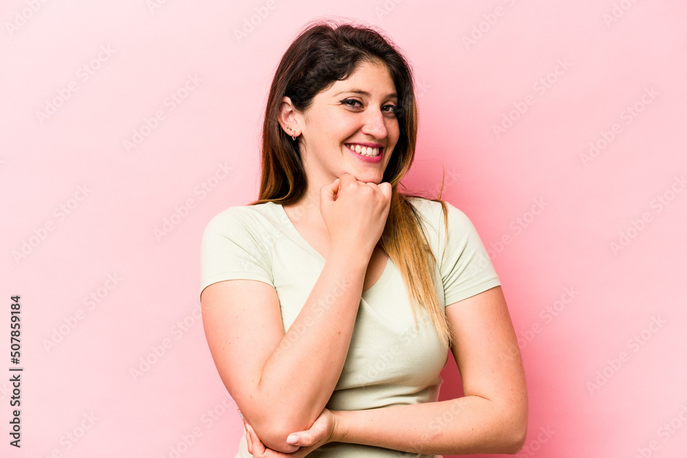 Young caucasian woman isolated on pink background smiling happy and confident, touching chin with hand. Young caucasian woman isolated on pink background smiling happy and confident, touching chin with hand.