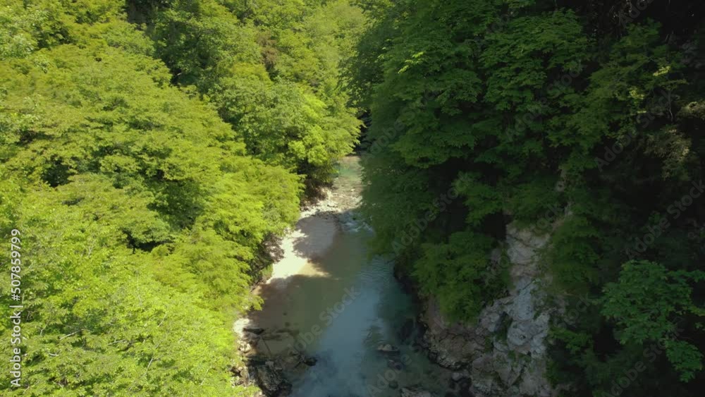 top-down cool view of a thin river in the canyon. High quality 4k footage top-down cool view of a thin river in the canyon. High quality 4k footage