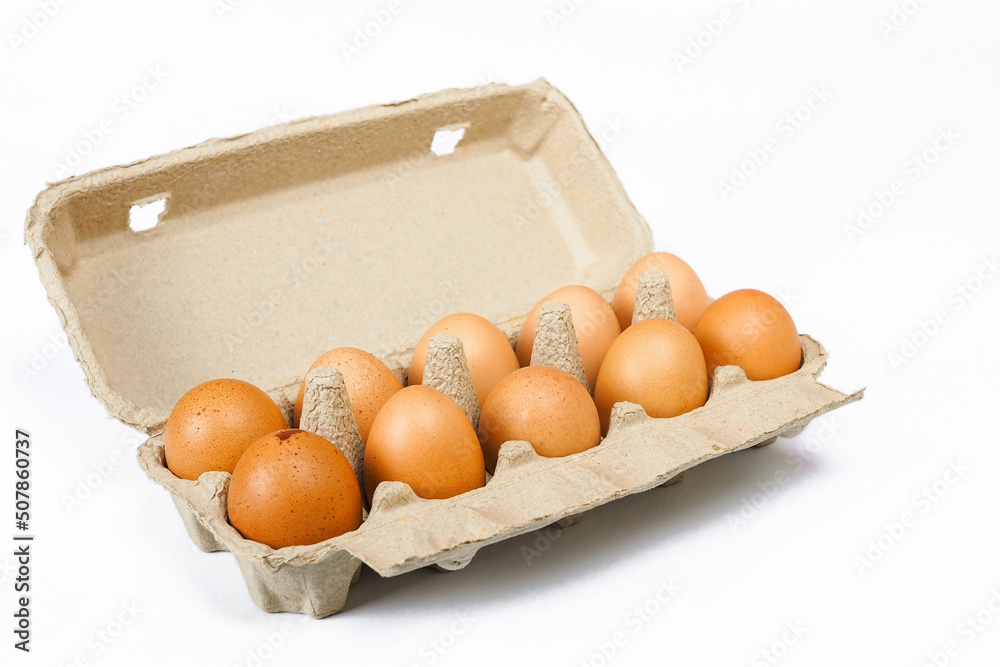 Eggs in a paper tray with white background