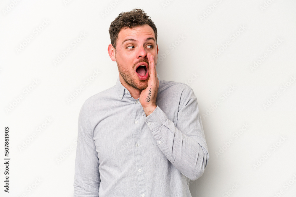 Young caucasian man isolated on white background shouting excited to front. Young caucasian man isolated on white background shouting excited to front.