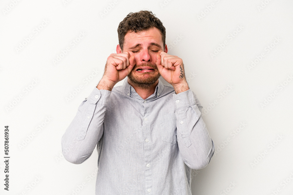Young caucasian man isolated on white background whining and crying disconsolately. Young caucasian man isolated on white background whining and crying disconsolately.