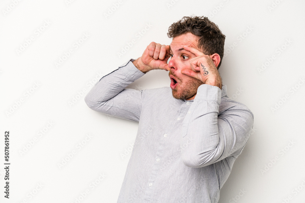 Young caucasian man isolated on white background keeping eyes opened to find a success opportunity. Young caucasian man isolated on white background keeping eyes opened to find a success opportunity.
