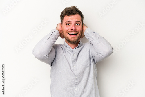 Young caucasian man isolated on white background screaming with rage.