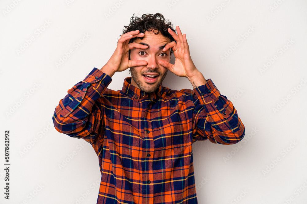 Young caucasian man isolated on white background keeping eyes opened to find a success opportunity. Young caucasian man isolated on white background keeping eyes opened to find a success opportunity.