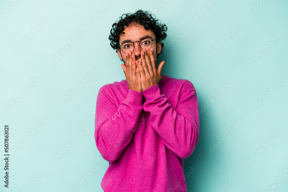 Young caucasian man isolated on white background shocked, covering mouth with hands, anxious to discover something new. Young caucasian man isolated on white background shocked, covering mouth with hands, anxious to discover something new.