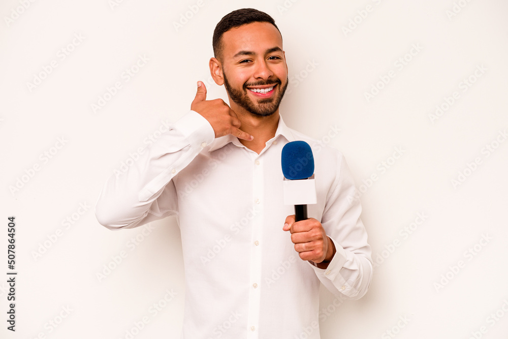 Young hispanic TV presenter isolated on blue background showing a mobile phone call gesture with fingers. Young hispanic TV presenter isolated on blue background showing a mobile phone call gesture with fingers.