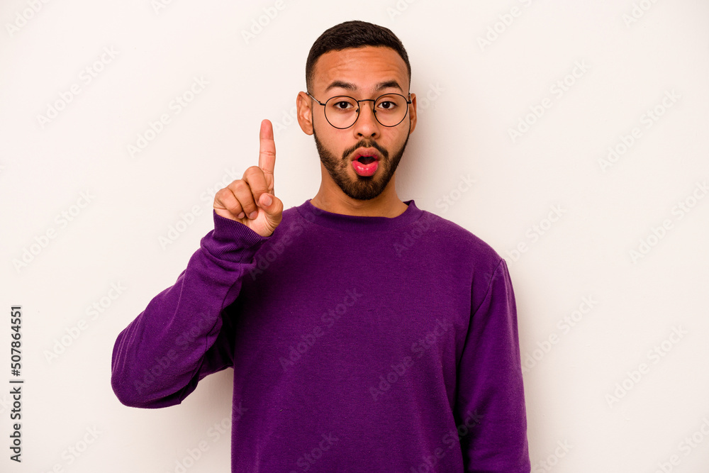 Young hispanic man isolated on white background having an idea, inspiration concept.