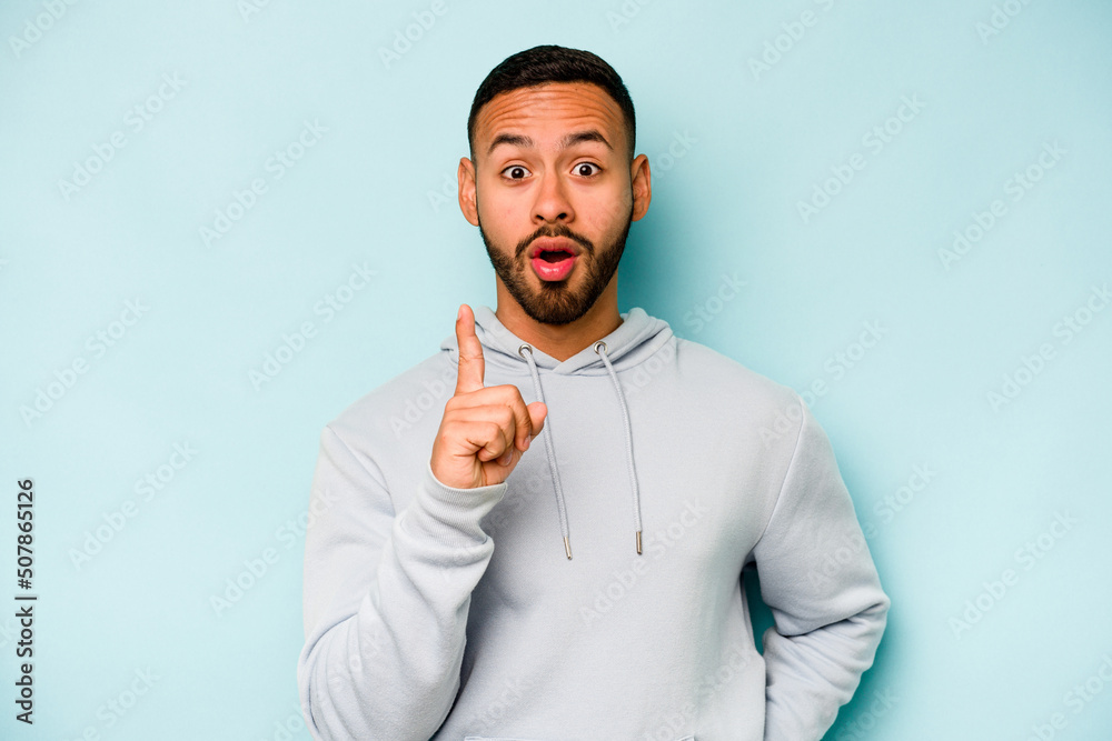 Young hispanic man isolated on blue background having an idea, inspiration concept. Young hispanic man isolated on blue background having an idea, inspiration concept.