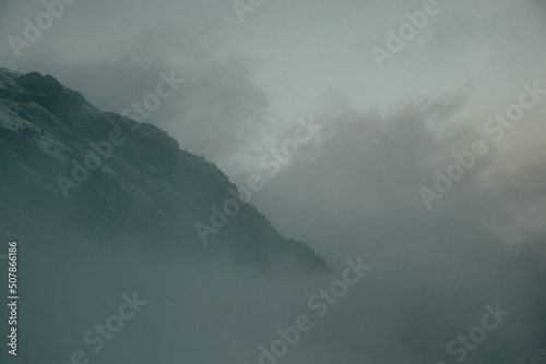 Snow and ice mountains during cloudy and foggy day © Jesus Ce