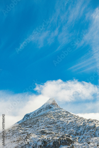 Mountain peak with clouds and snow