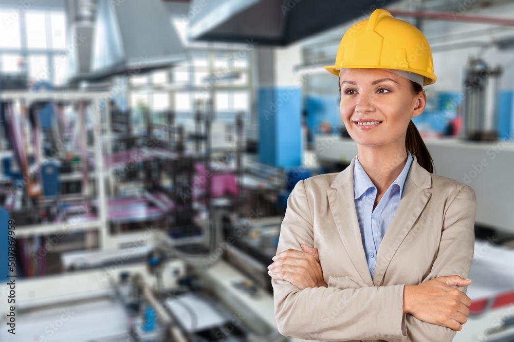 Woman engineer working control machine in factory. Woman engineer working control machine in factory.