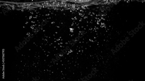 Water bubbles floating on black background with oil paint effect which represent refreshing of refreshment from soda or carbonated drink and power of liquid that splashing by air pump.
