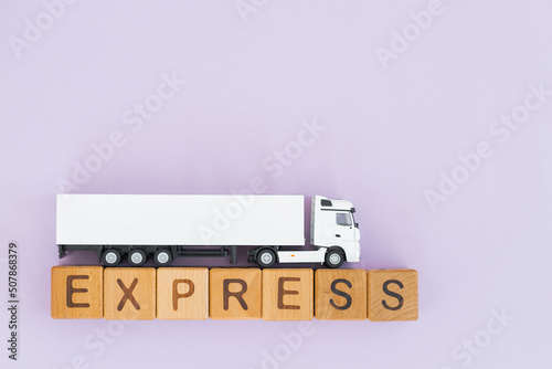White truck with wooden box on yellow background. Express delivery