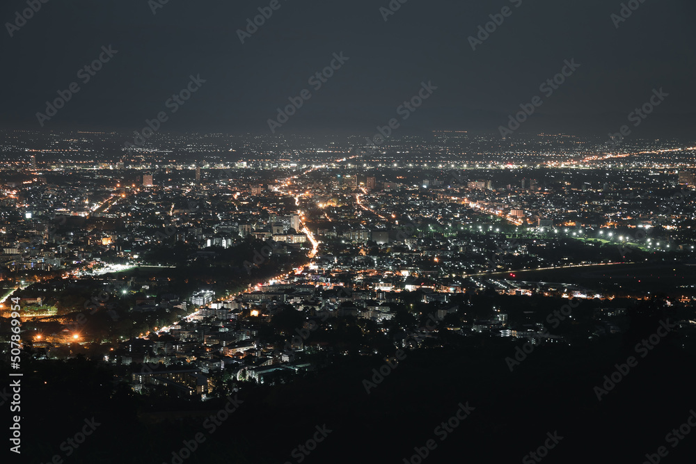 Top view of City night and light from the view point on top of mountain. Chiang Mai, Thailand. Aerial view, night city view with night sky.