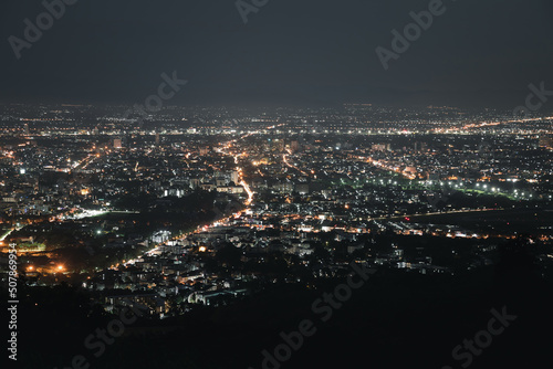 Top view of City night and light from the view point on top of mountain. Chiang Mai  Thailand. Aerial view  night city view with night sky.