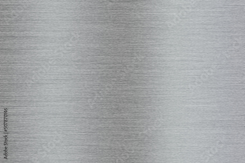 Silver metal texture of brushed stainless steel plate with the reflection of light.