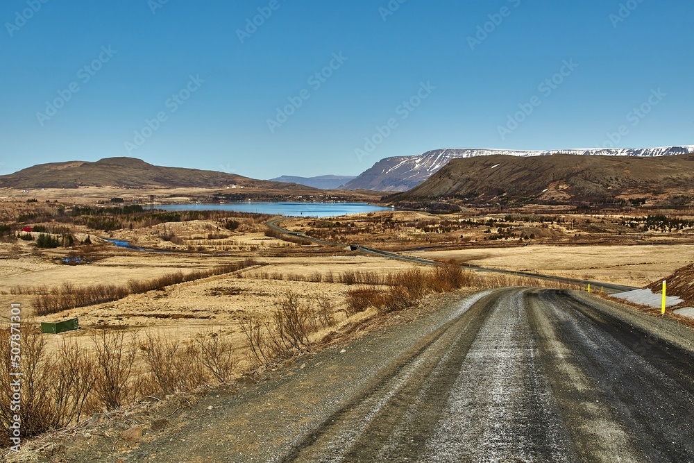 Gravel road in Iceland by a lakeside