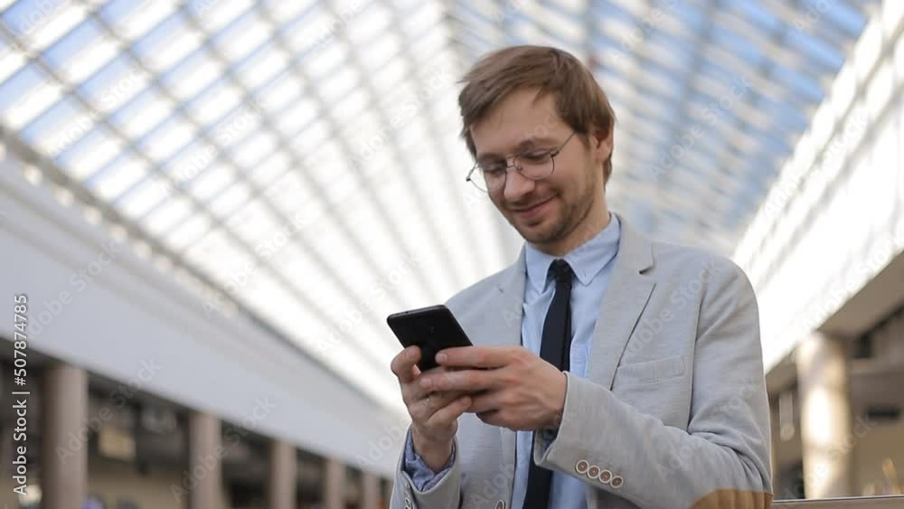 Young businessman with mobile phone chat on social networks Young businessman with mobile phone chat on social networks