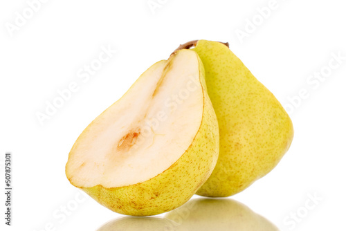Two halves of a juicy yellow pear, close-up, isolated on a white background.