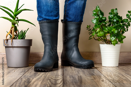 Man in Slate Grey Rubber Boots gardening at home