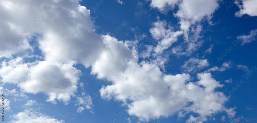 Obraz premium Panoramic photo of blurred sky. Blue sky background with cumulus clouds