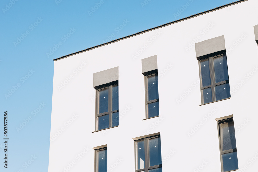 Fragments of facades of modern residential buildings, side view, close-up.