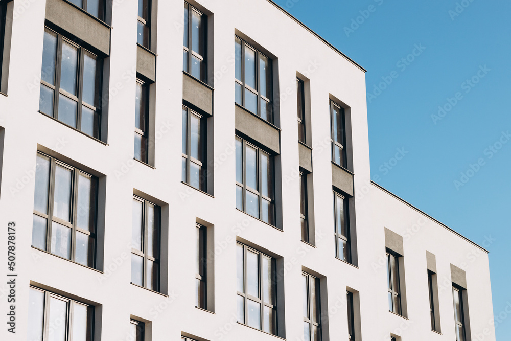 Fragments of facades of modern residential buildings, side view, close-up.