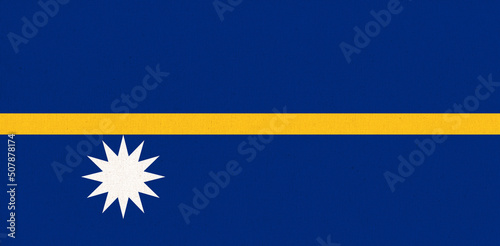 Flag of Nauru. Nauru flag on fabric surface. Fabric Texture. National symbol