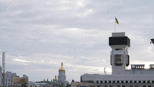 Ukrainian national flag is unfolding in the wind with the sky background