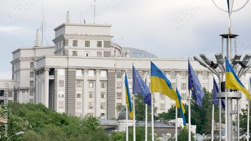 Ukrainian national flag at the European square in Kyiv  is unfolding in the wind 