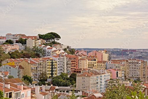 Apartment buildings in Graca neighborhood and viewpoint of our Lady of the hill, Lisbon, Portugal 