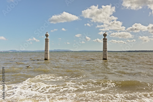 river Tagus with pillars of Cais da colunas quay in front, Lisbon photo