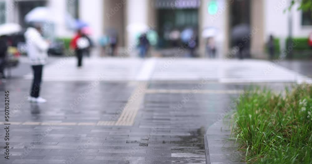 Walking people on the street in Marunouchi Tokyo rainy day Walking people on the street in Marunouchi Tokyo rainy day