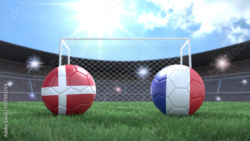 Two soccer balls in flags colors on stadium blurred background. Denmark and France. 3d image