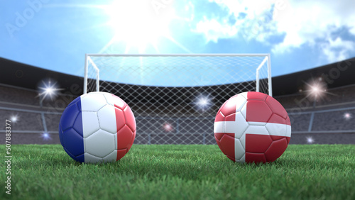 Two soccer balls in flags colors on stadium blurred background. France and Denmark. 3d image