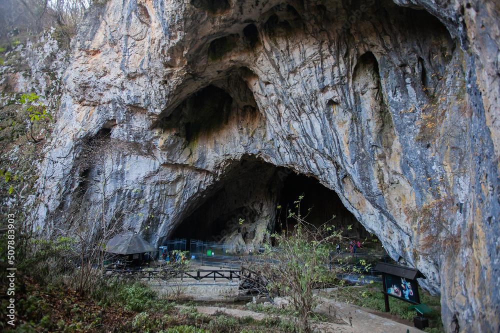 Cave entrance, geology natural landscape. Limestone cave at mountain Zlatibor, Serbia.