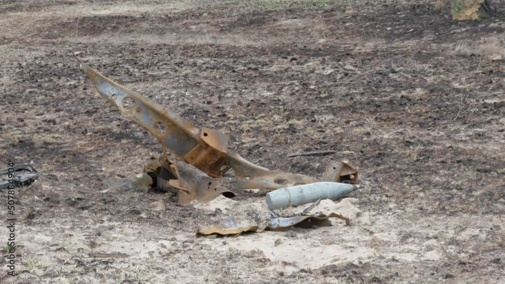 Unexploded artillery shell on the ground Unexploded artillery shell on the ground