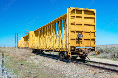 Yellow train car on a remote track in Idaho