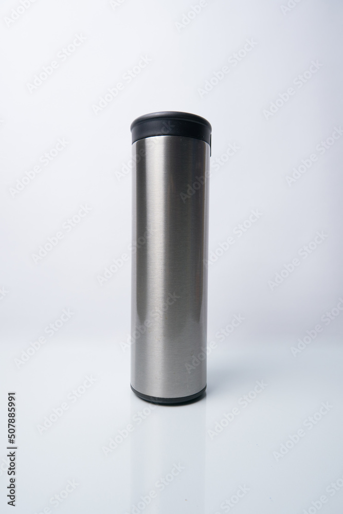 Stainless steel thermos bottle isolated on a white background
